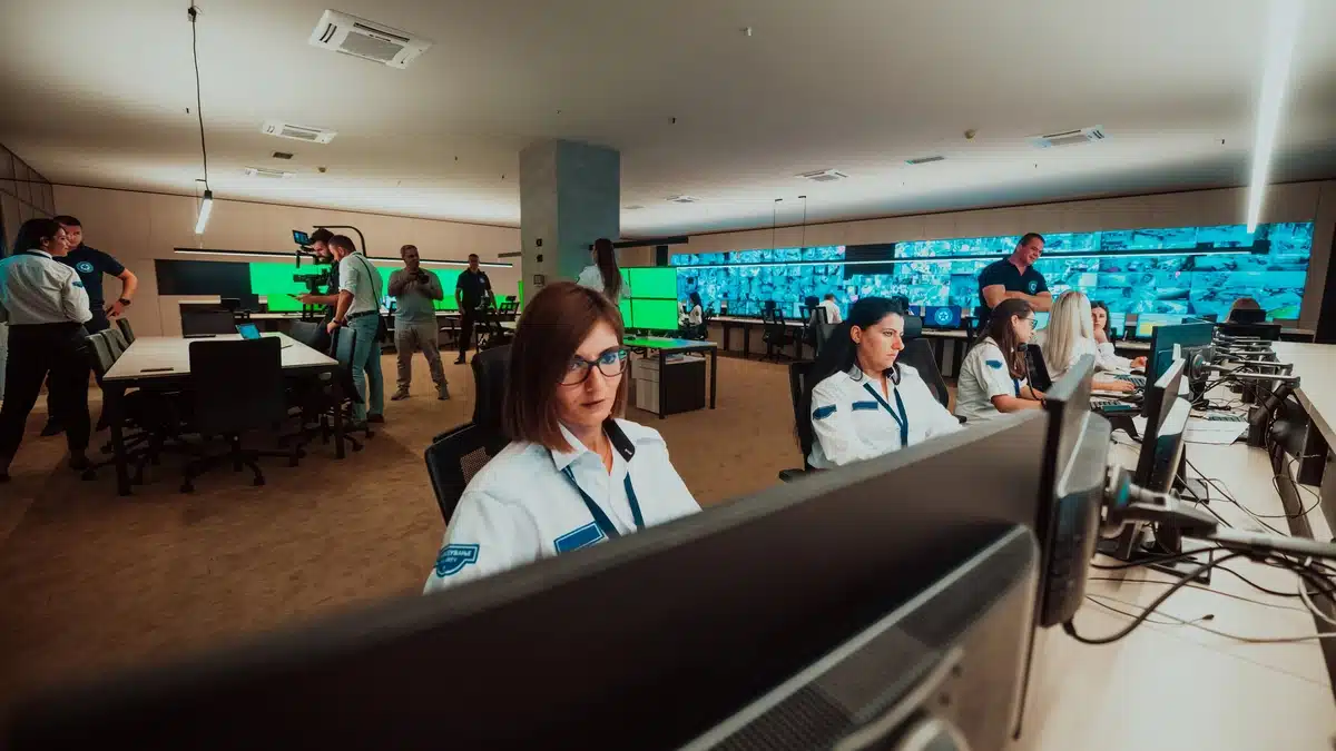 How Professional Security Guards Support Fort Worth’s Rapid Commercial Growth Professional security guards play a key role in Fort Worth’s fast-growing commercial sector, providing active monitoring, rapid response, and consistent protection — illustrated by security personnel overseeing multiple screens in a control room.