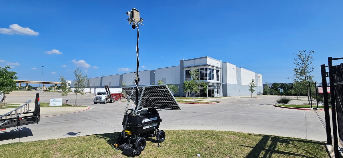 tcs-trailer-cameras-1 Solar-powered surveillance trailer outside large warehouse building